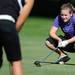 Pioneer's Sloane Supica lines up her shot during golf regionals at the University of Michigan Golf Course on Thursday. Melanie Maxwell I AnnArbro.com